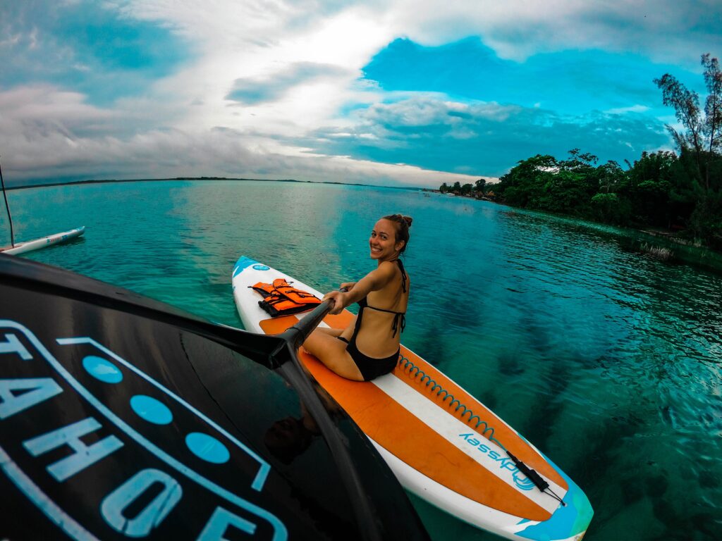 A girl enjoying paddle boarding and busting myths about the sport